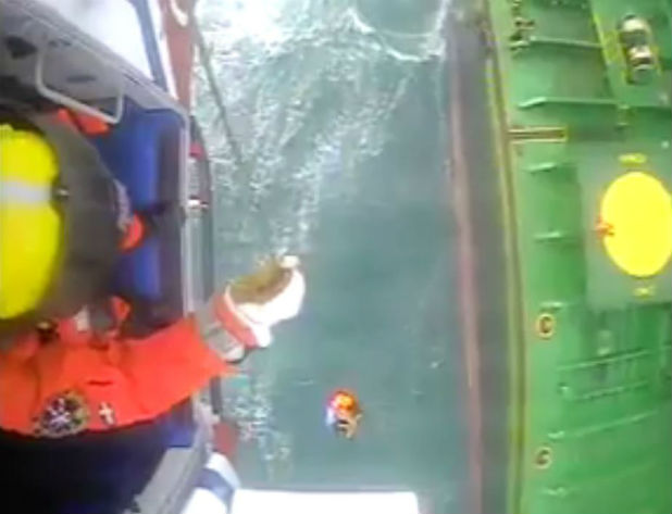 The coastguard has released dramatic footage from its rescue helicopter called to help an injured seaman in 60mph winds off Cornwall. 